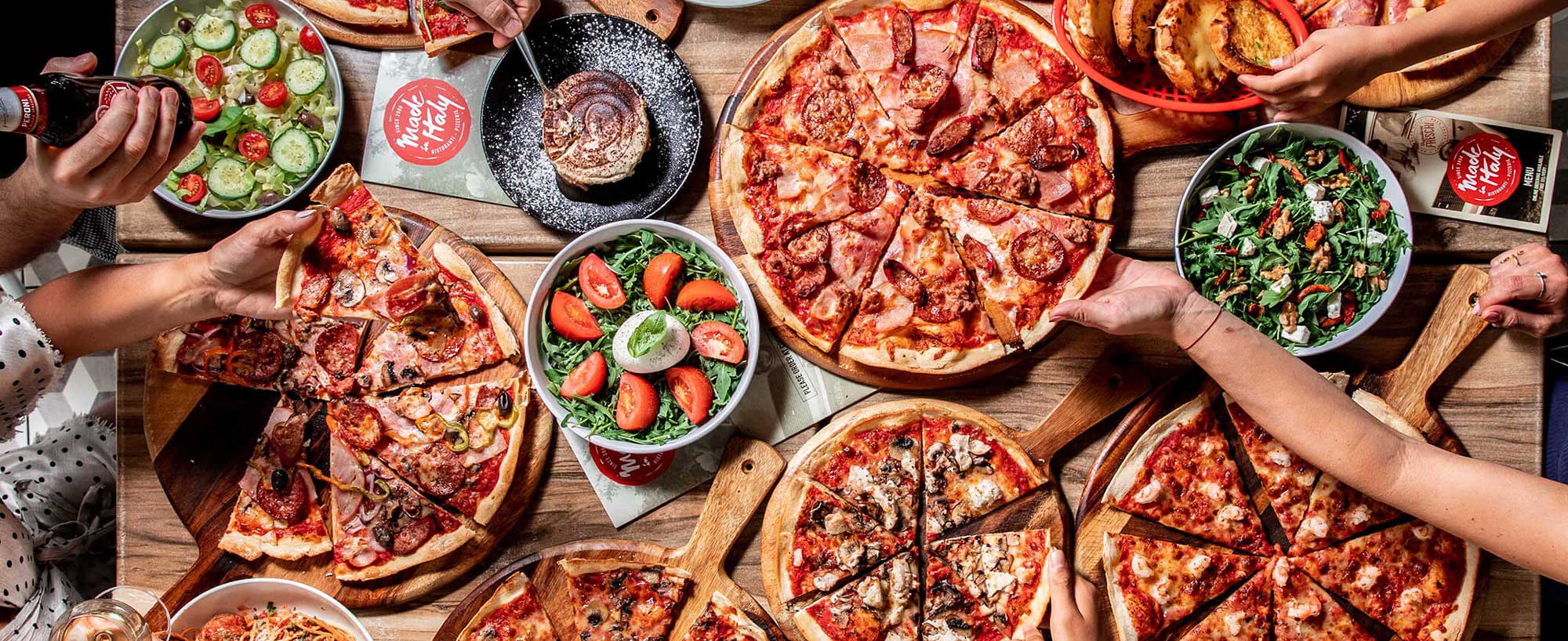 Made In Italy Italian pizza catering Sydney — XL Roman-style pizza platters ready for corporate delivery
